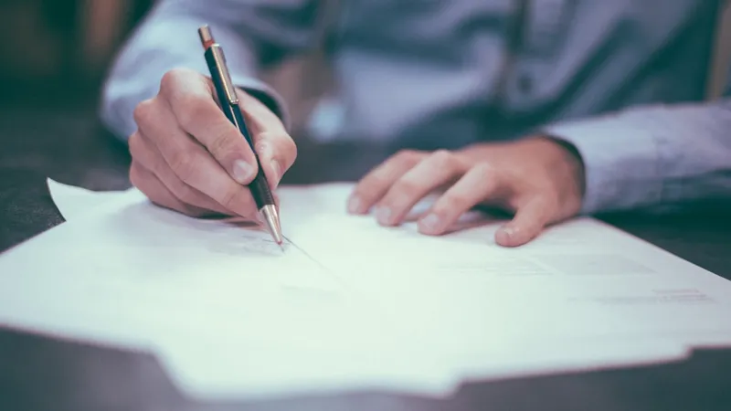 Document with signature lines on a clean desk